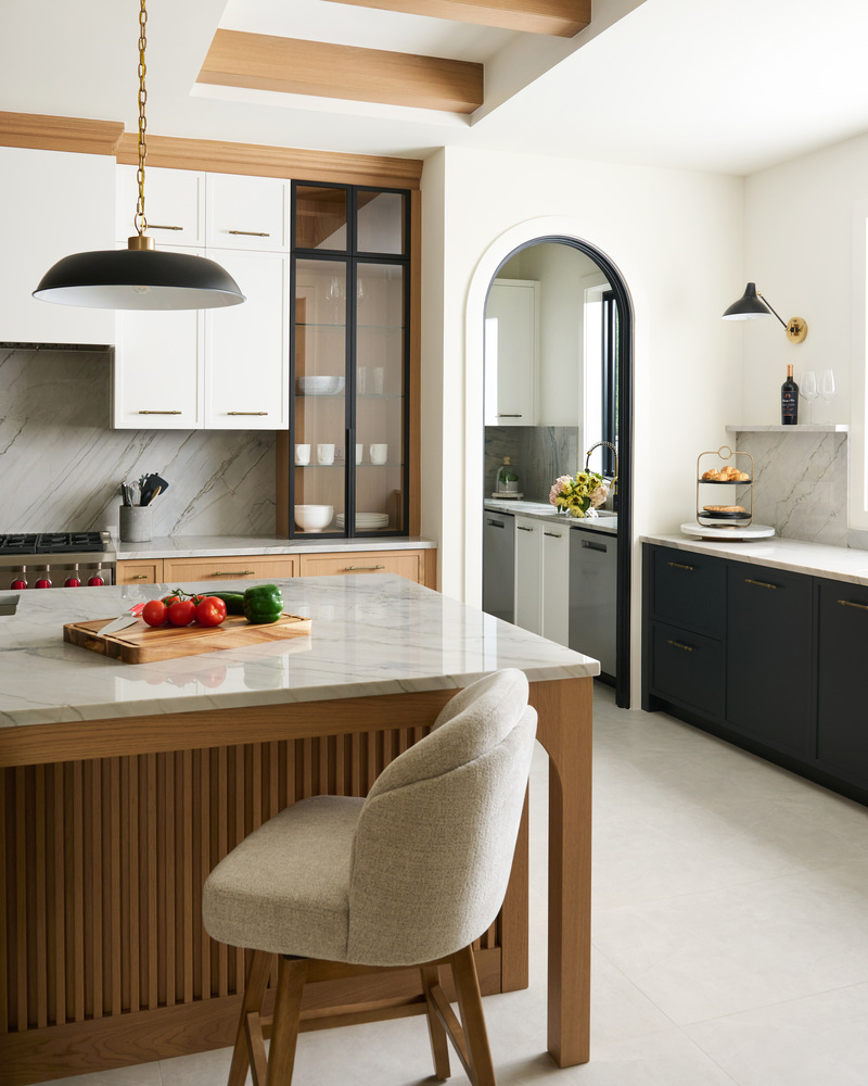 Modern kitchen space in Arlington, VA custom home with warm wood tones and black framed glass cabinets by DesignLab