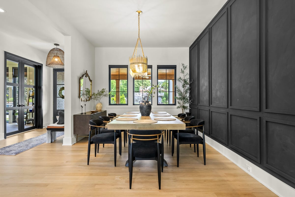 Formal dining room with black accent wall in Washington, DC designed by DesignLab
