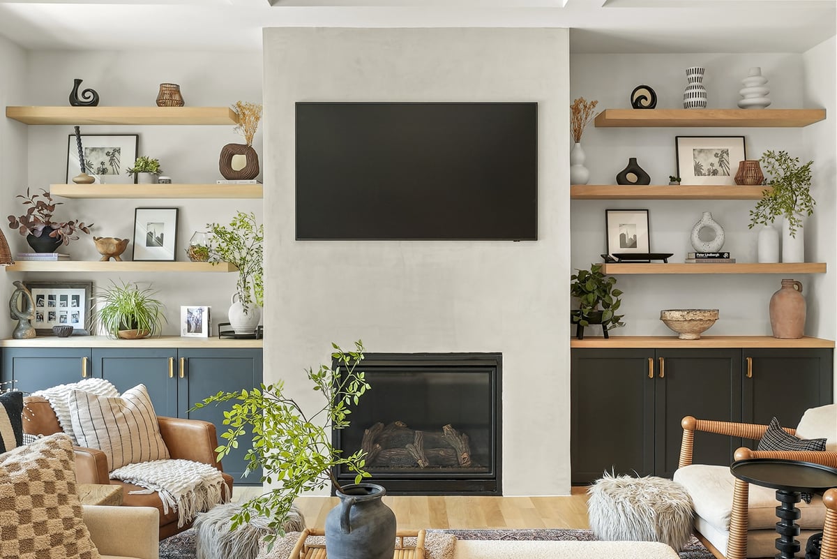 Living room with built-in shelves and a fireplace