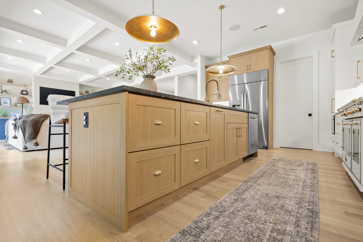 Vienna, VA, kitchen with light wood kitchen island and wood floors.