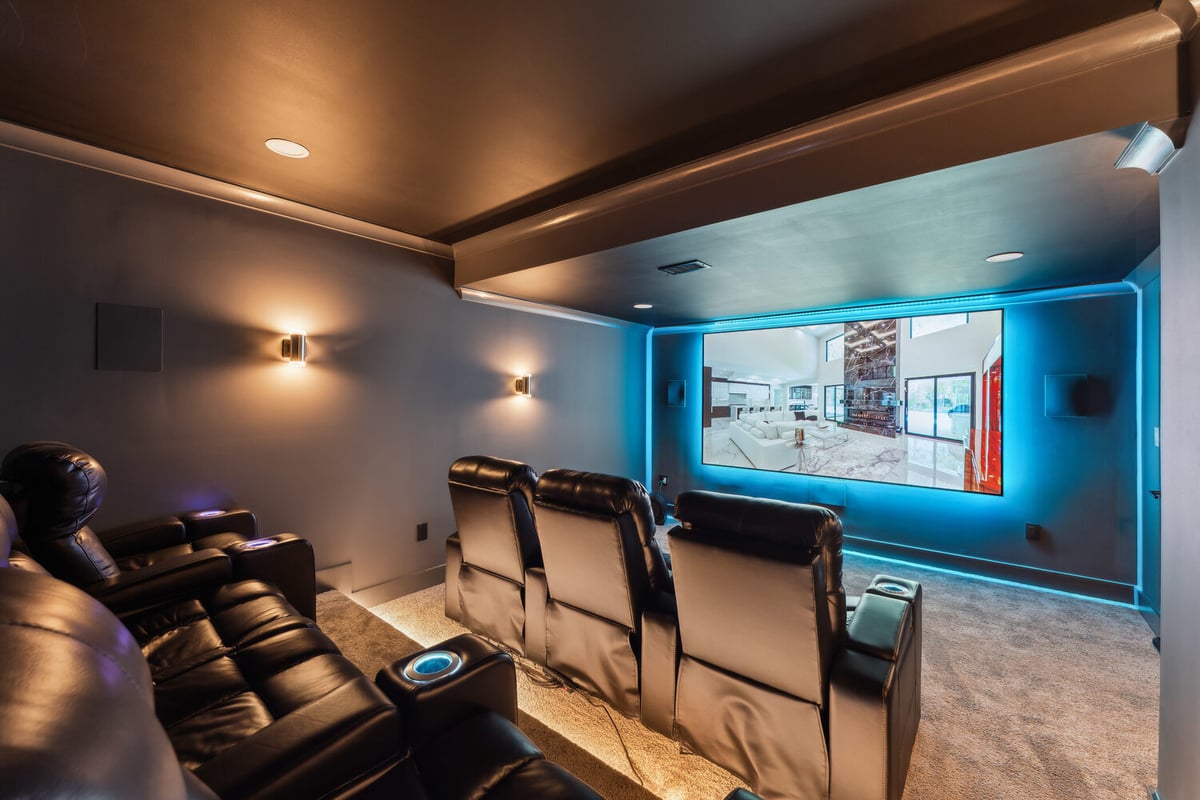 Home theater remodel with tiered recliner seating and large screen by DesignLab in Metro Washington