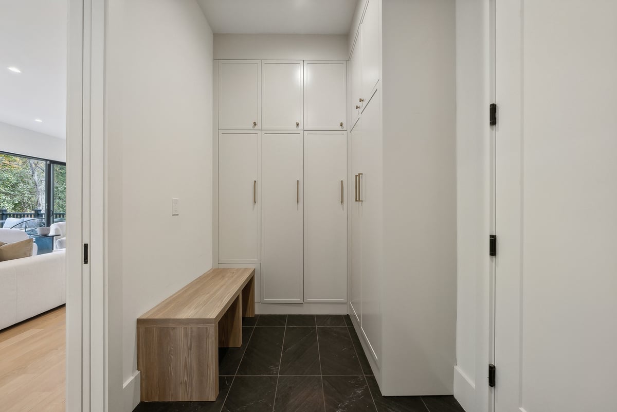 Entry mudroom with custom built-in cabinetry and bench in a DesignLab custom home in Falls Church, VA