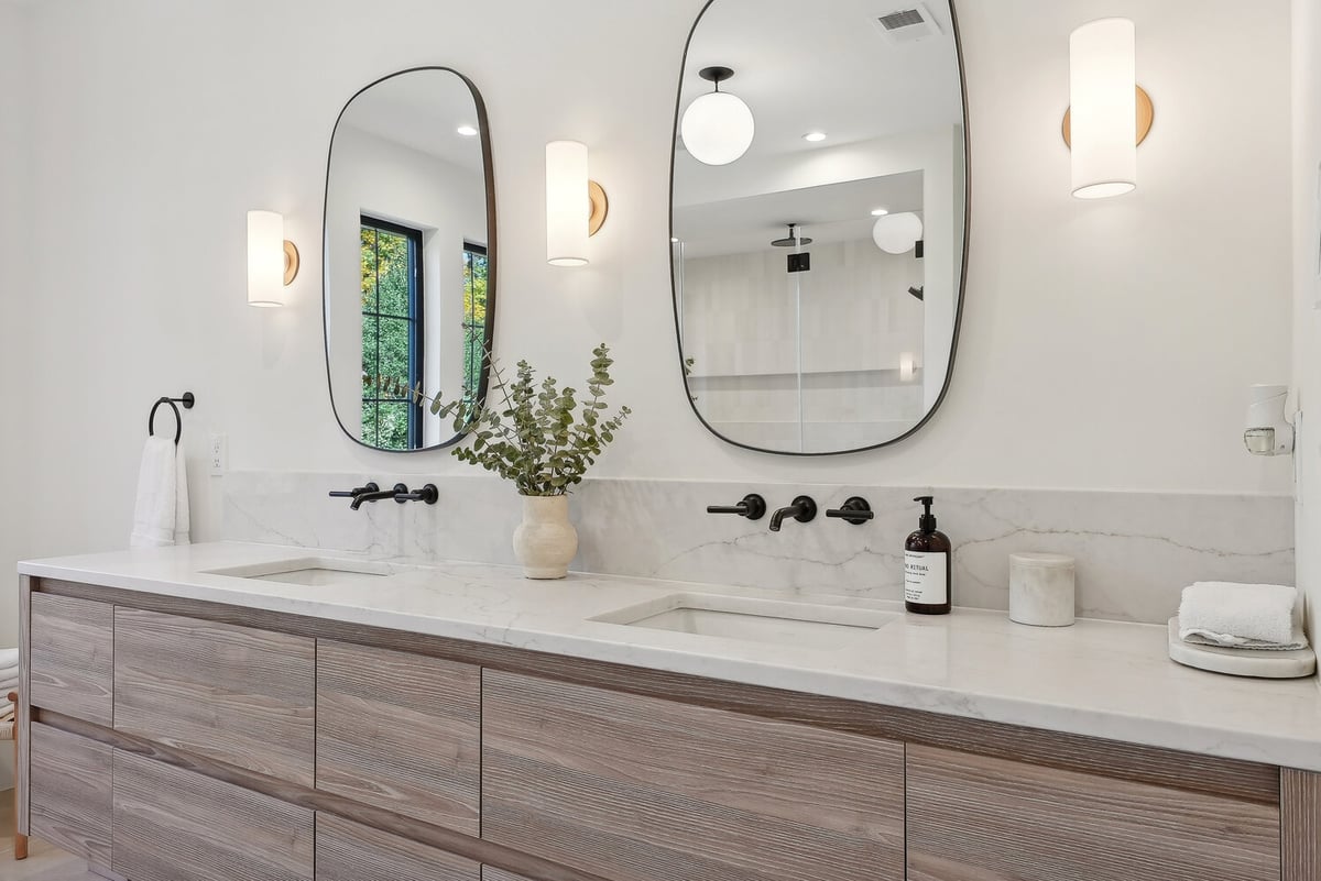 Upscale bathroom design with eucalyptus centerpiece and soft lighting by DesignLab in AU Park, DC