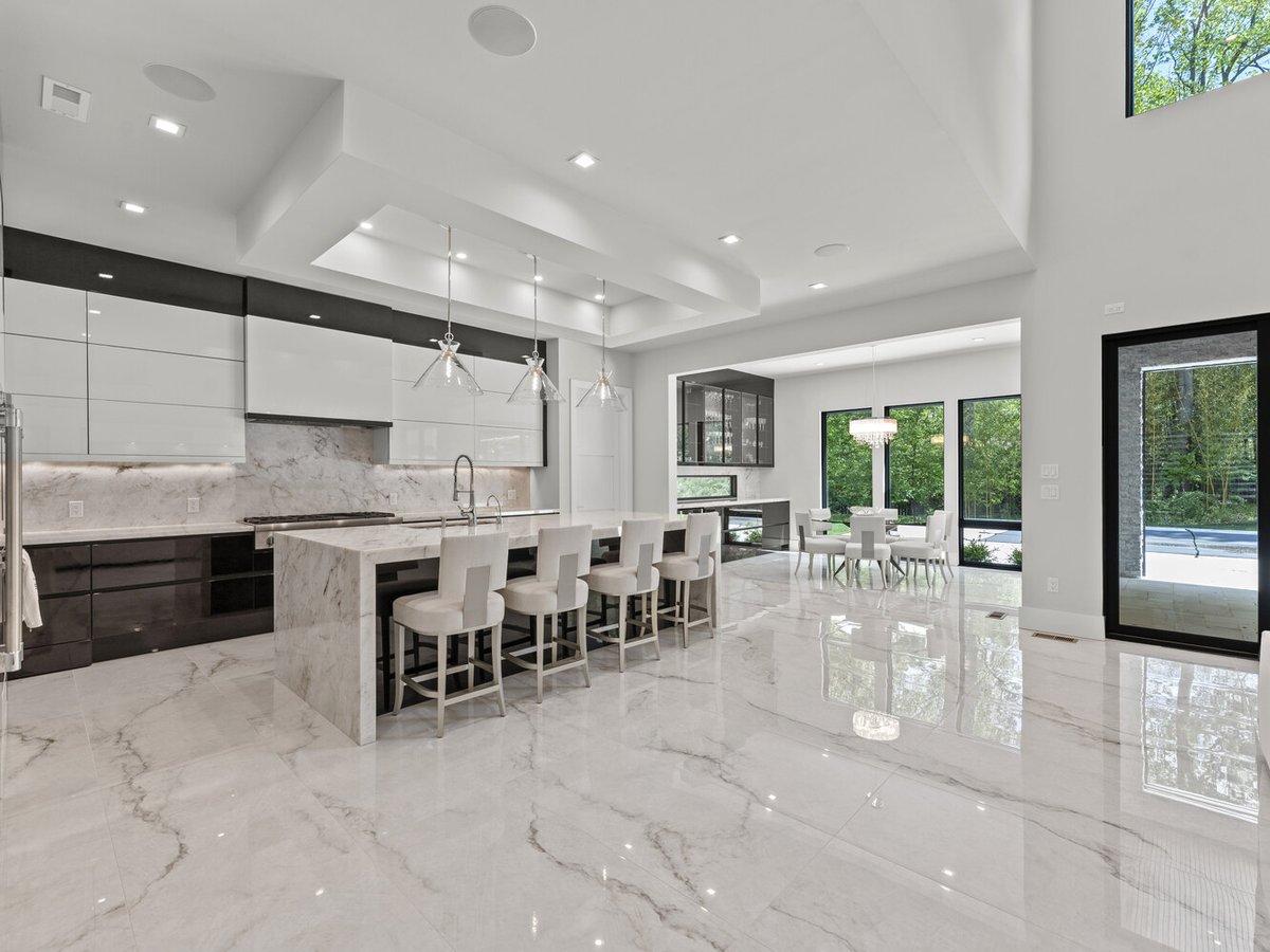 Luxury kitchen with oversized island and modern pendant lights in a DesignLab home in Arlington, VA