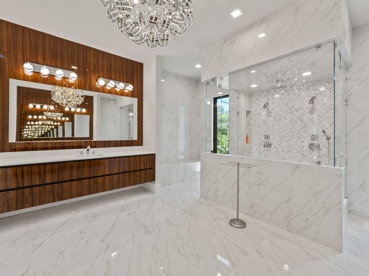 Marble master bathroom with dual shower and wood vanity by DesignLab in Northern Virginia custom home