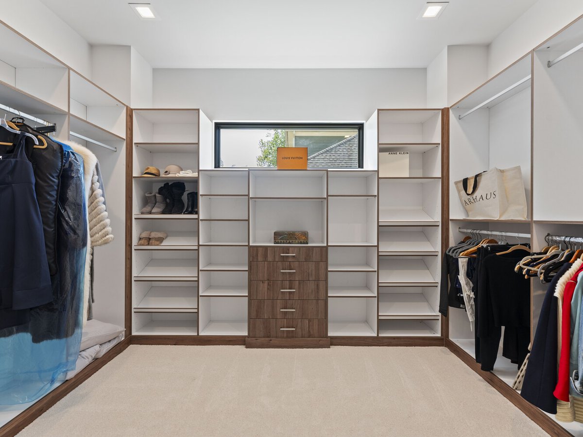 Walk-in closet with custom shelving and modern design by DesignLab in Northern Virginia whole home
