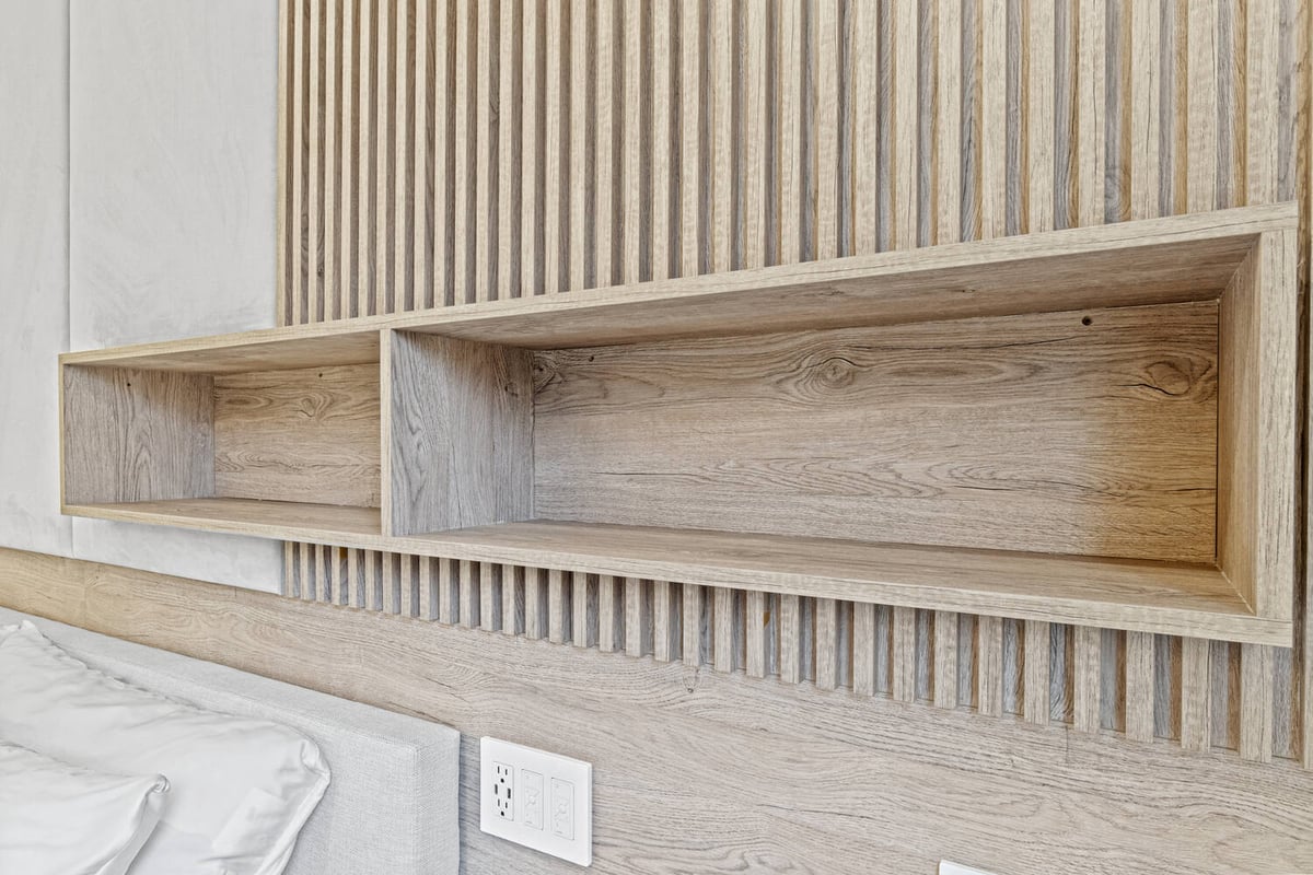 Built-in wood shelving detail in a custom home bedroom by DesignLab in Metro Washington