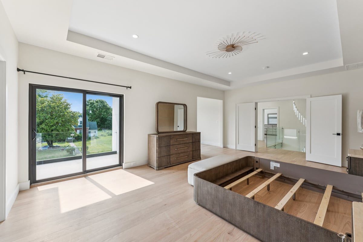 Bright master bedroom remodel with balcony access by DesignLab in Kalorama, DC