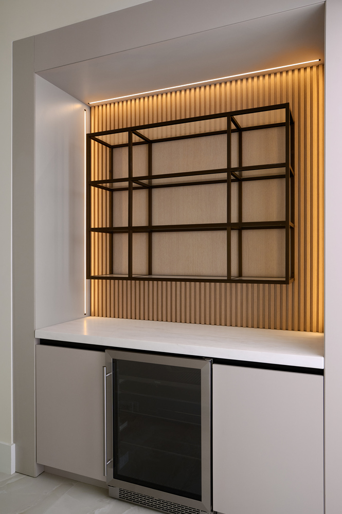 Built-in beverage station with metal shelving and accent lighting by DesignLab in Metro Washington