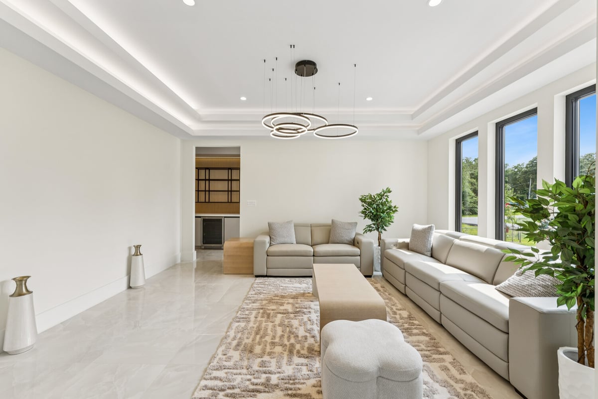 Cozy luxury living room with neutral tones and modern furniture by DesignLab in Georgetown