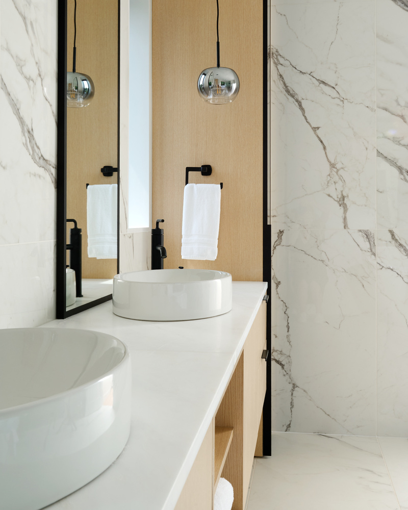 Custom bathroom finishes with black hardware and modern design by DesignLab in Arlington, VA