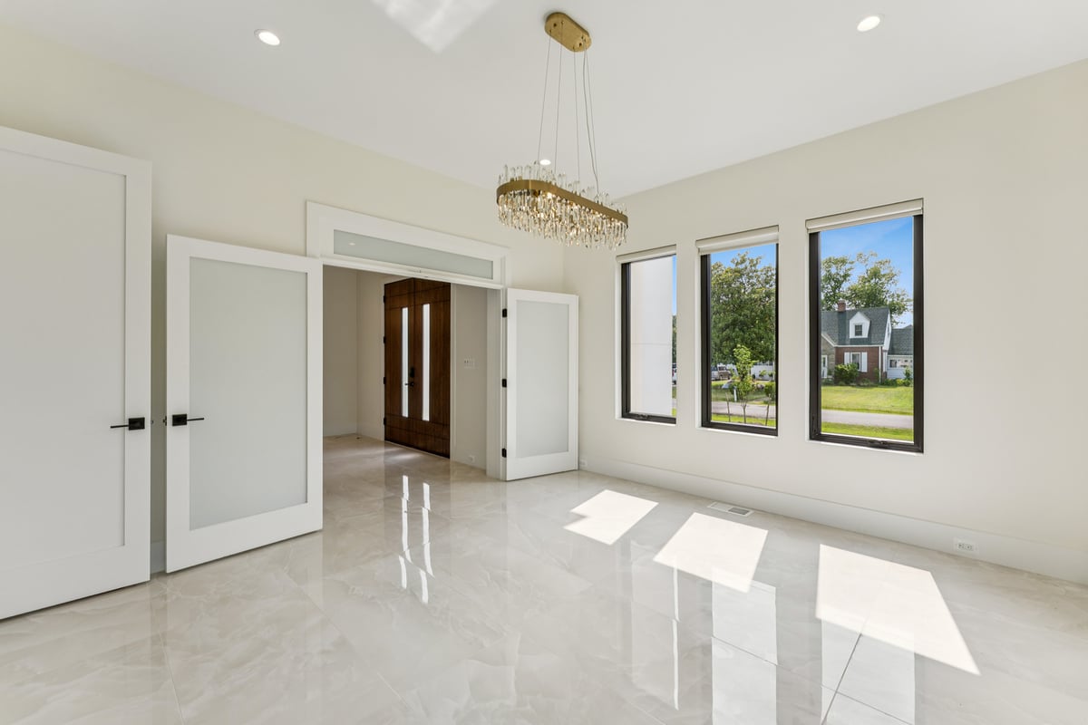 Elegant modern entryway and bright room in a custom home by DesignLab in Chevy Chase