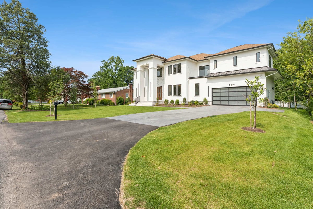 Luxury modern home facade with spacious driveway by DesignLab in Bethesda, Maryland