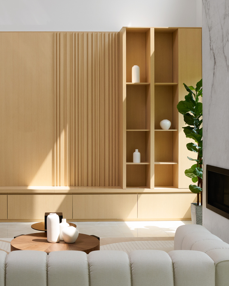Oak shelving with decorative vases in a Metro Washington custom home by DesignLab