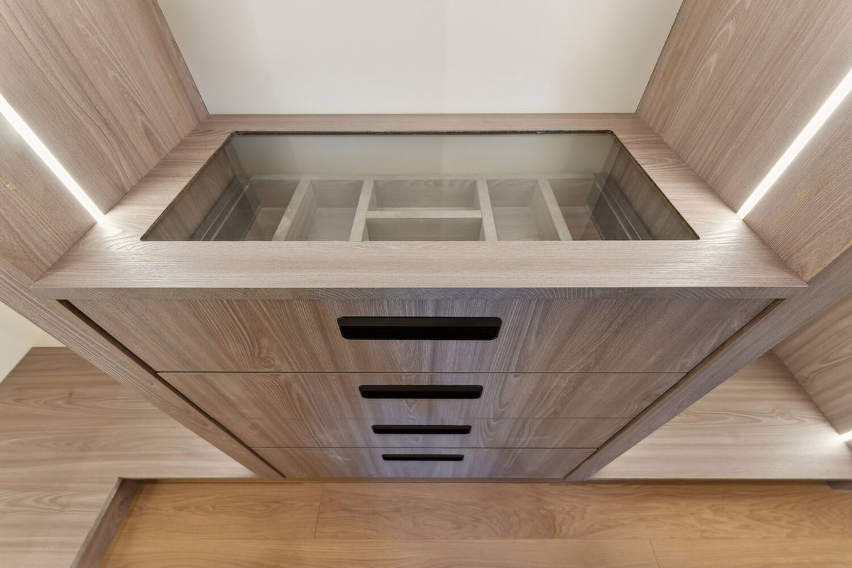 Jewelry drawer with glass top in custom closet design by DesignLab in Arlington, VA