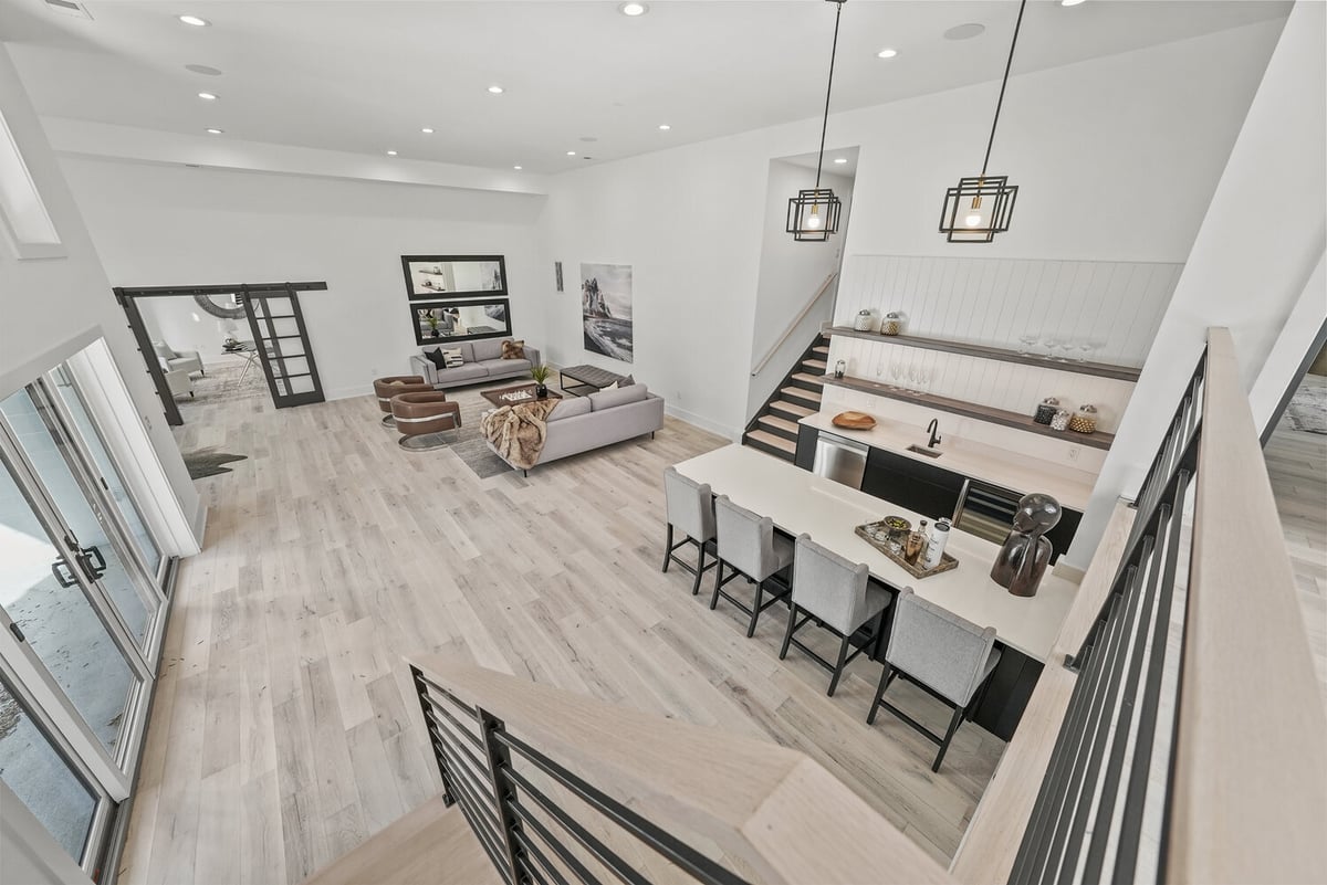 Airy main floor with modern kitchen island and seating in a DesignLab home in Falls Church, VA