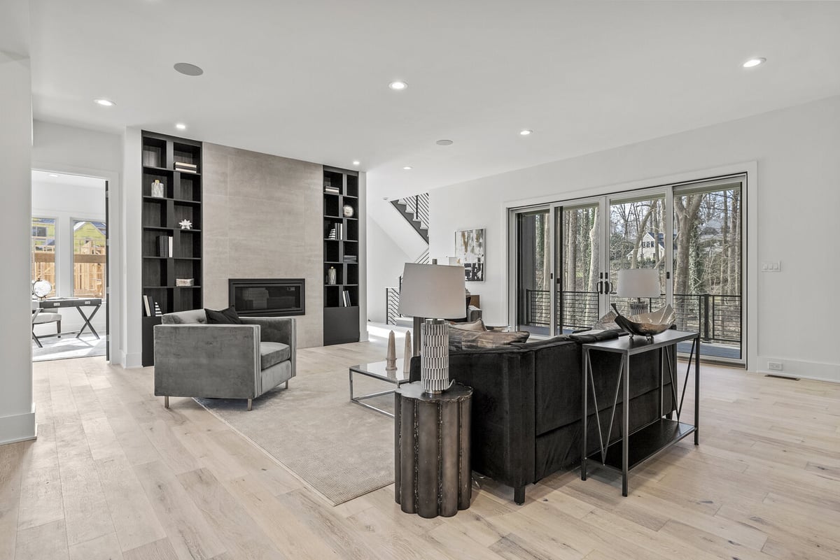 Bright and airy open-plan living room designed by DesignLab in Metro Washington with natural wood flooring