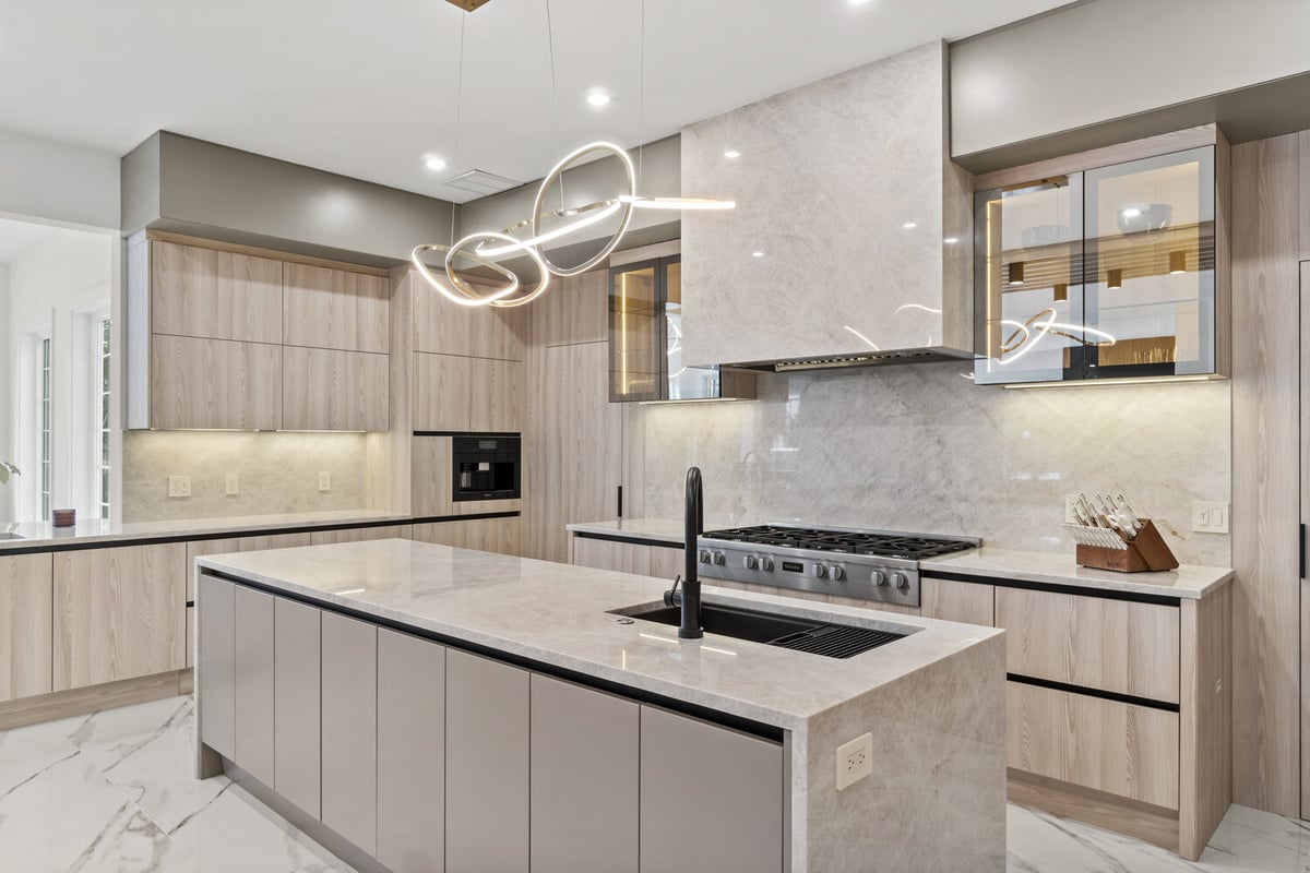 Modern kitchen remodel by DesignLab in Washington DC Metro featuring soft wood tones and unique lighting